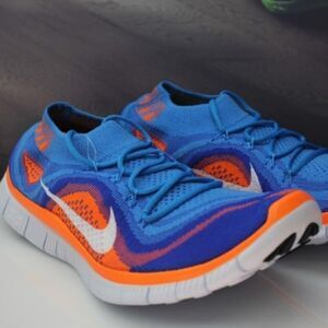 New in Box Nike Flyknit + Blue Glow Total Orange Mens 9.5 US 43 EUR RARE